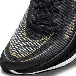 Nike Women's ZoomX Vaporfly Next % 2 Racing Shoe - Black/White/Metallic Gold Coin - Regular (B) 16 Nike Women's ZoomX Vaporfly Next % 2 Racing Shoe - Black/White/Metallic Gold Coin - Regular (B) -Women Shoes Shop CU4123 001 PHSYD001 1500